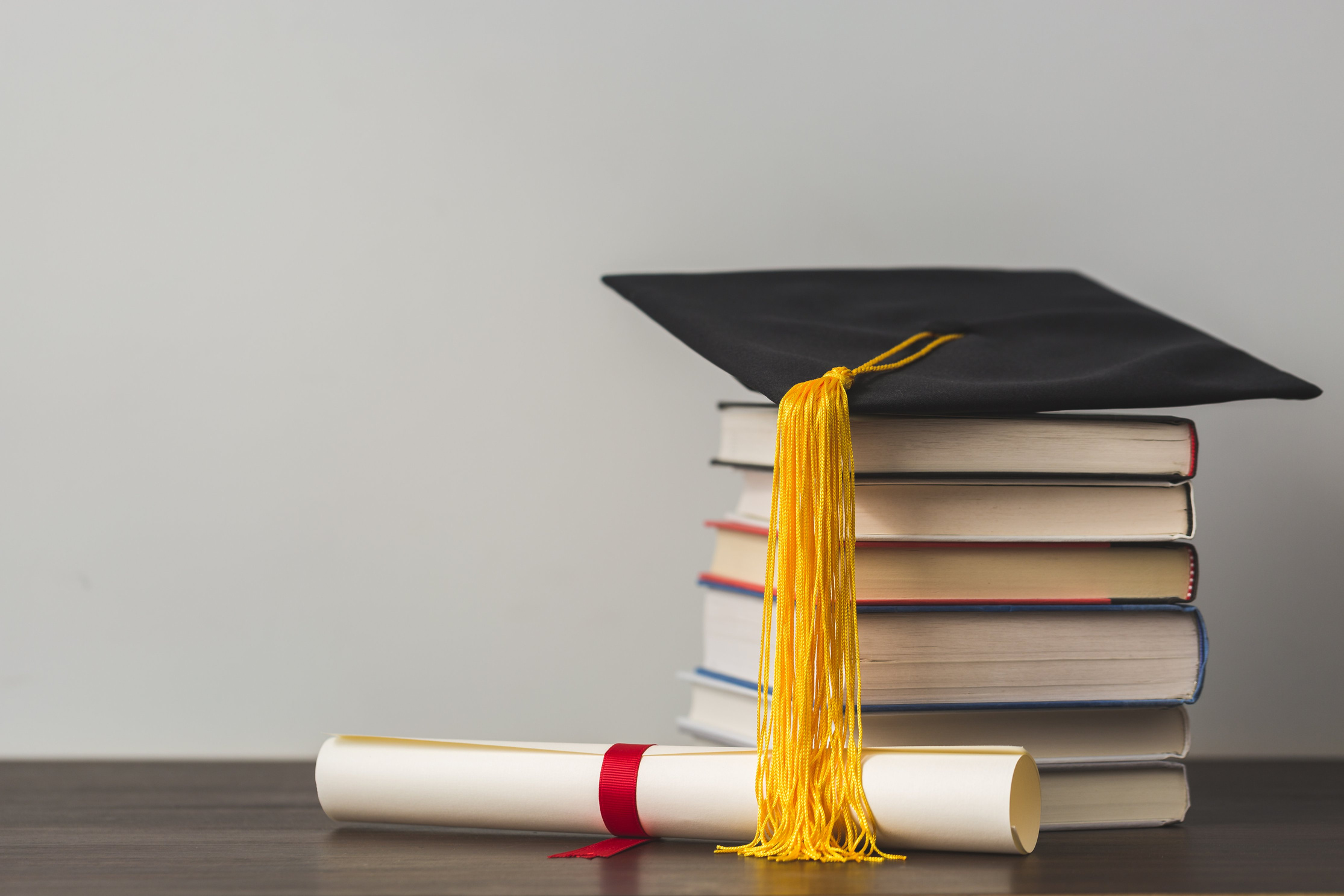 graduation cap and diploma